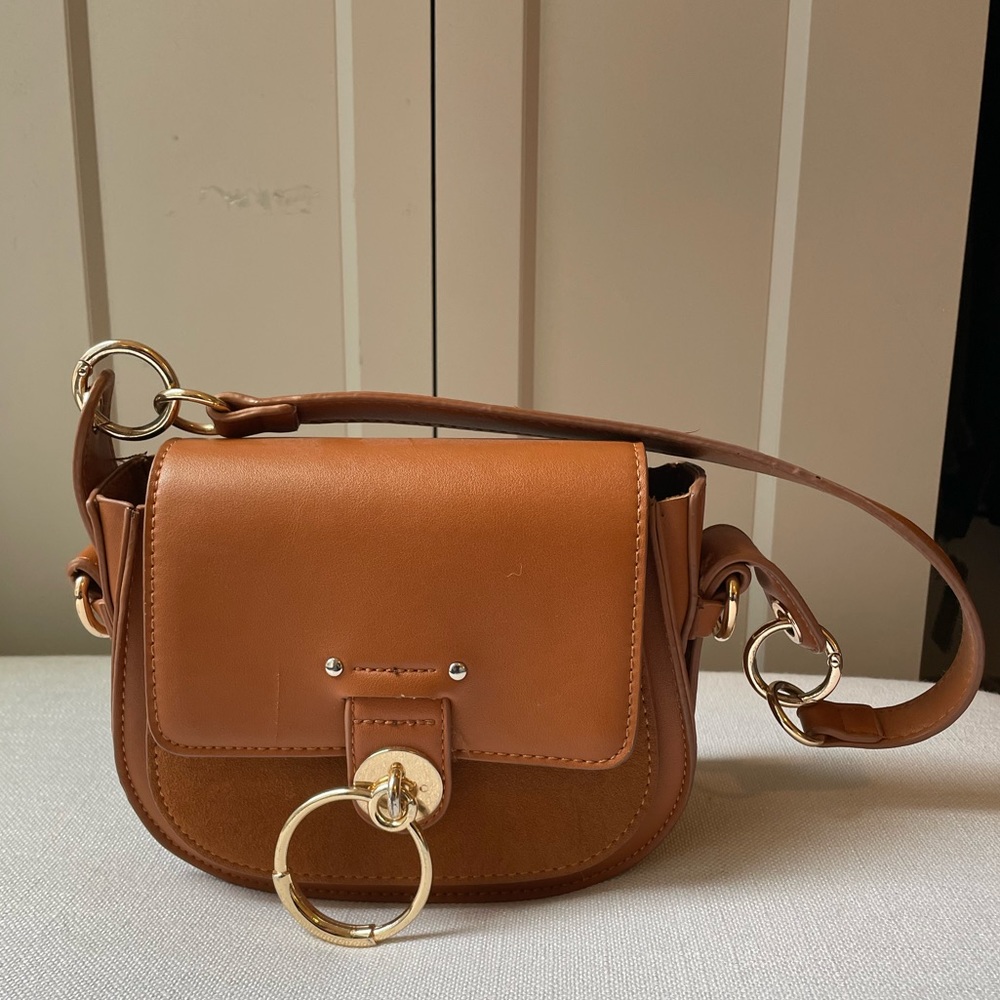 Brown leather and suede saddle bag with gold hardware